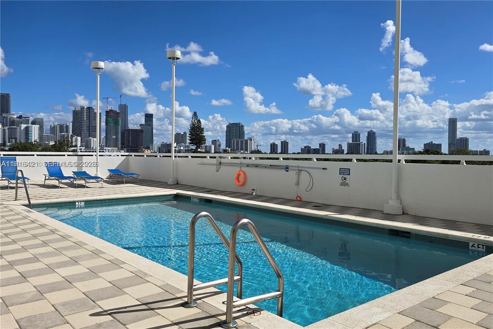 900 Southwest 8th Street, Unit 1010 Miami, FL 33130 - Photo 24 of 27 a view of a city with lawn chairs