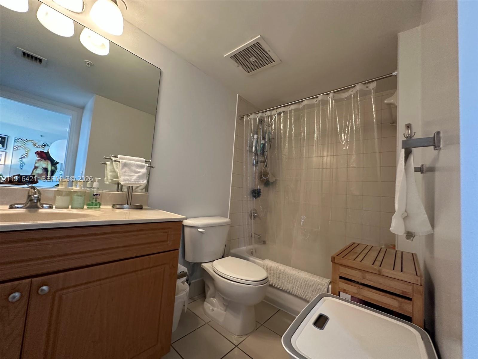 900 Southwest 8th Street, Unit 1010 Miami, FL 33130 - Photo 9 of 27 a bathroom with a sink a toilet a mirror and shower
