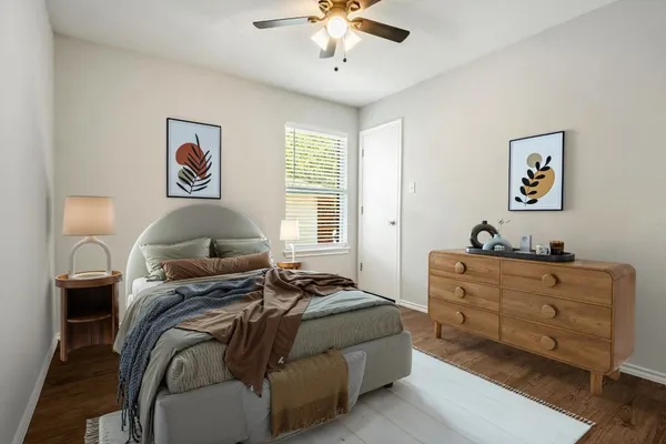 a bed room with a bed and a chandelier