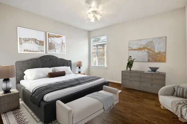 a bedroom with a bed and a window