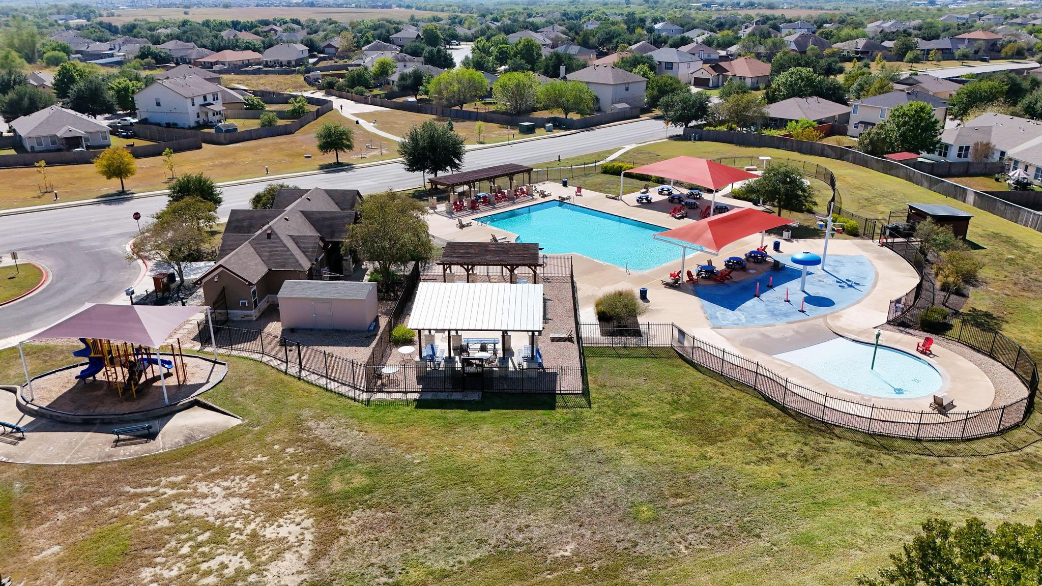162 Brandons Way Buda, TX 78610 - Photo 18 of 36 an aerial view of a swimming pool and outdoor space