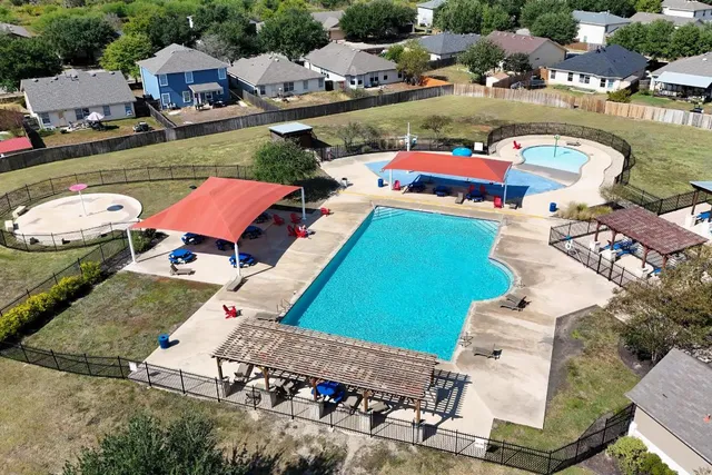an aerial view of a house with outdoor space