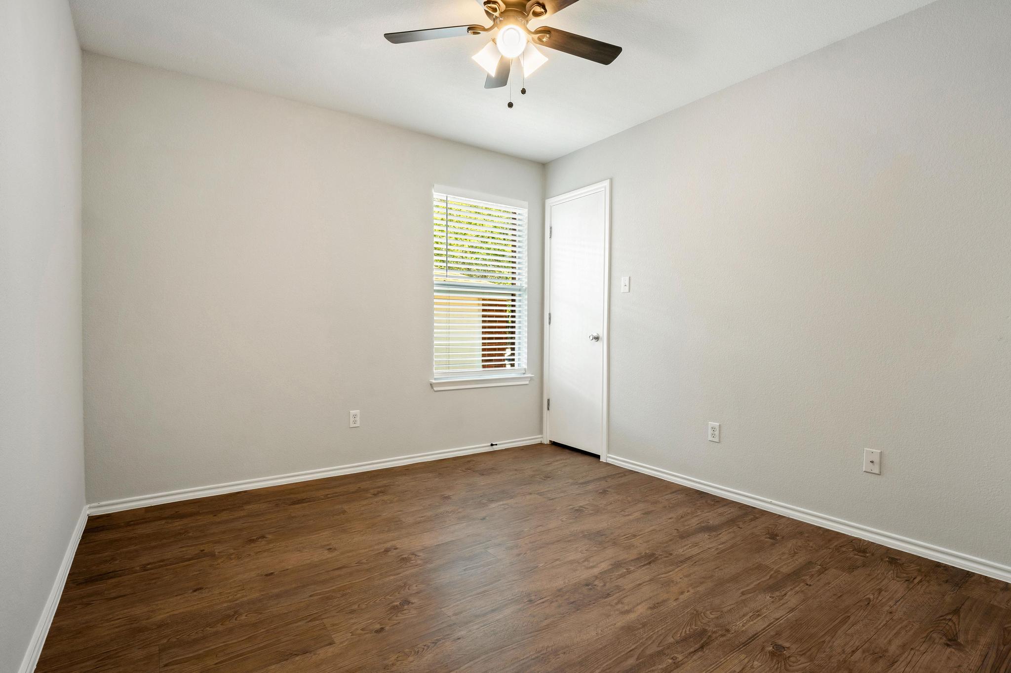 162 Brandons Way Buda, TX 78610 - Photo 34 of 36 a view of an empty room with a window