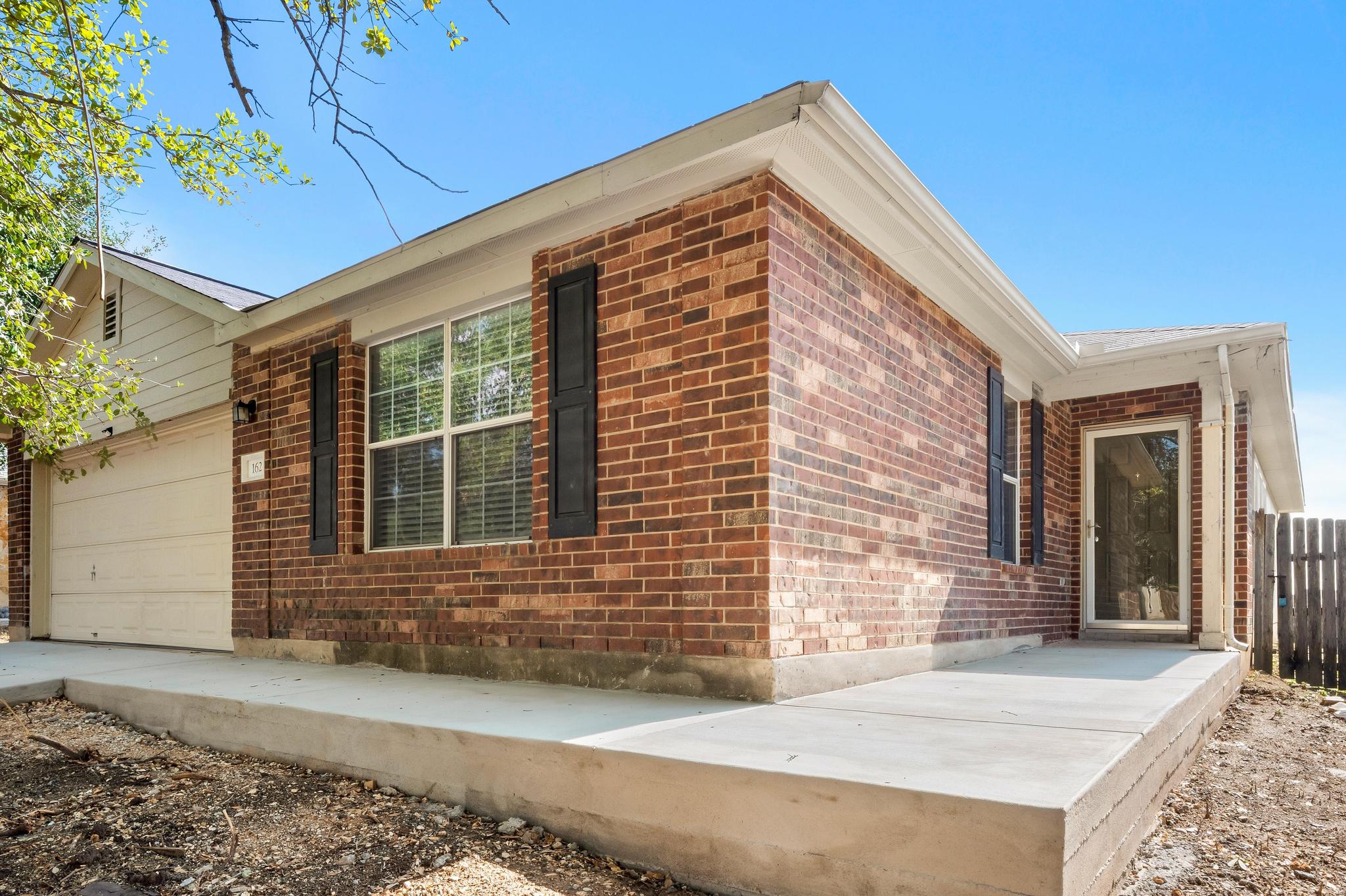 162 Brandons Way Buda, TX 78610 - Photo 4 of 36 a front view of a house
