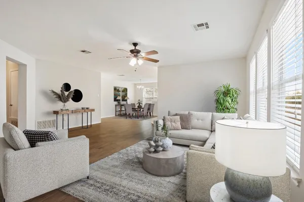 a living room with furniture and a large window