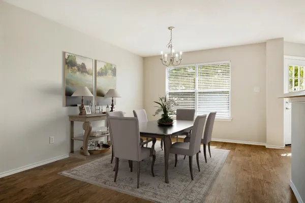 a view of a dining room with furniture window and wooden floor