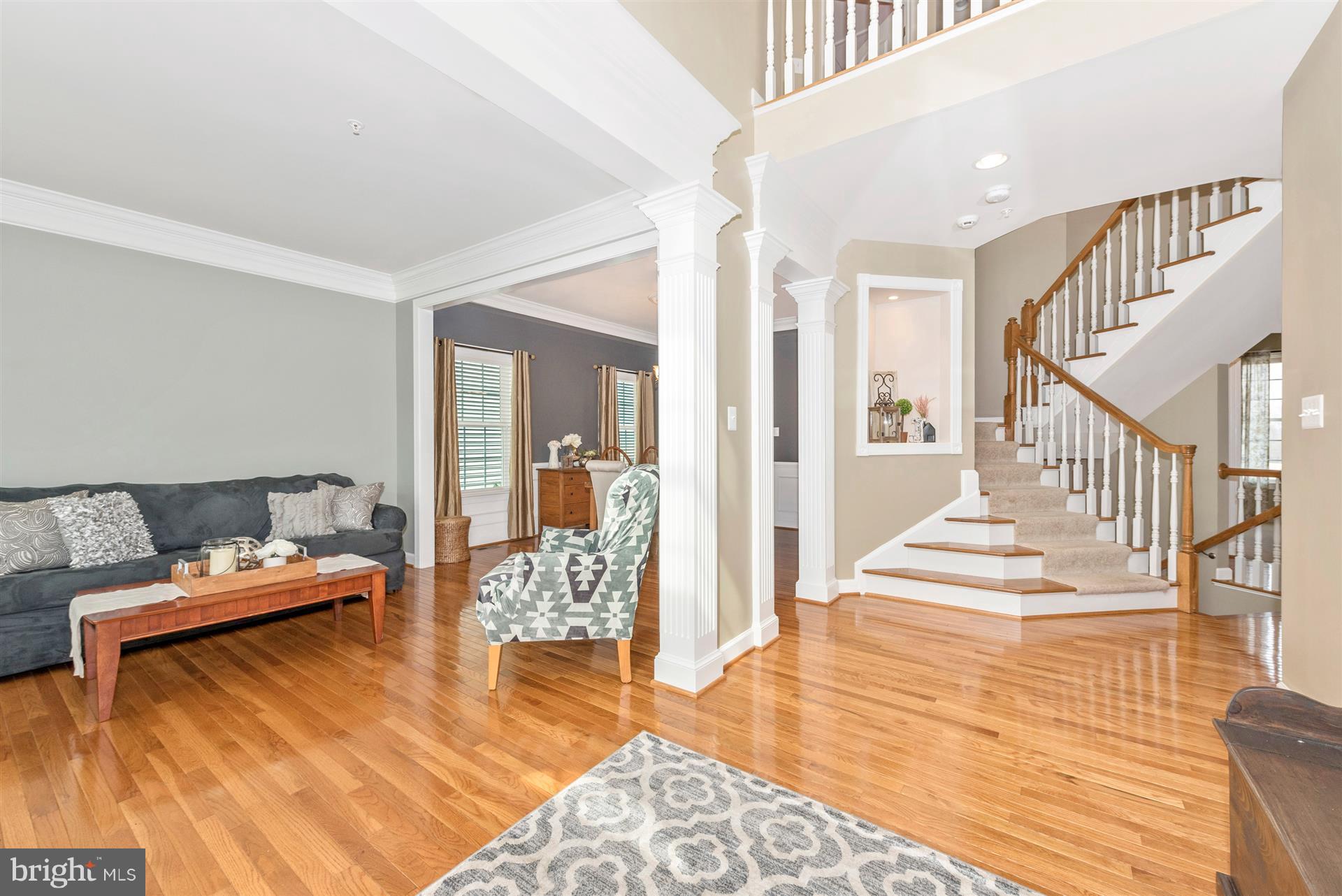 9158 Bealls Farm Road Frederick, MD 21704 - Photo 2 of 30 a living room with furniture and wooden floor