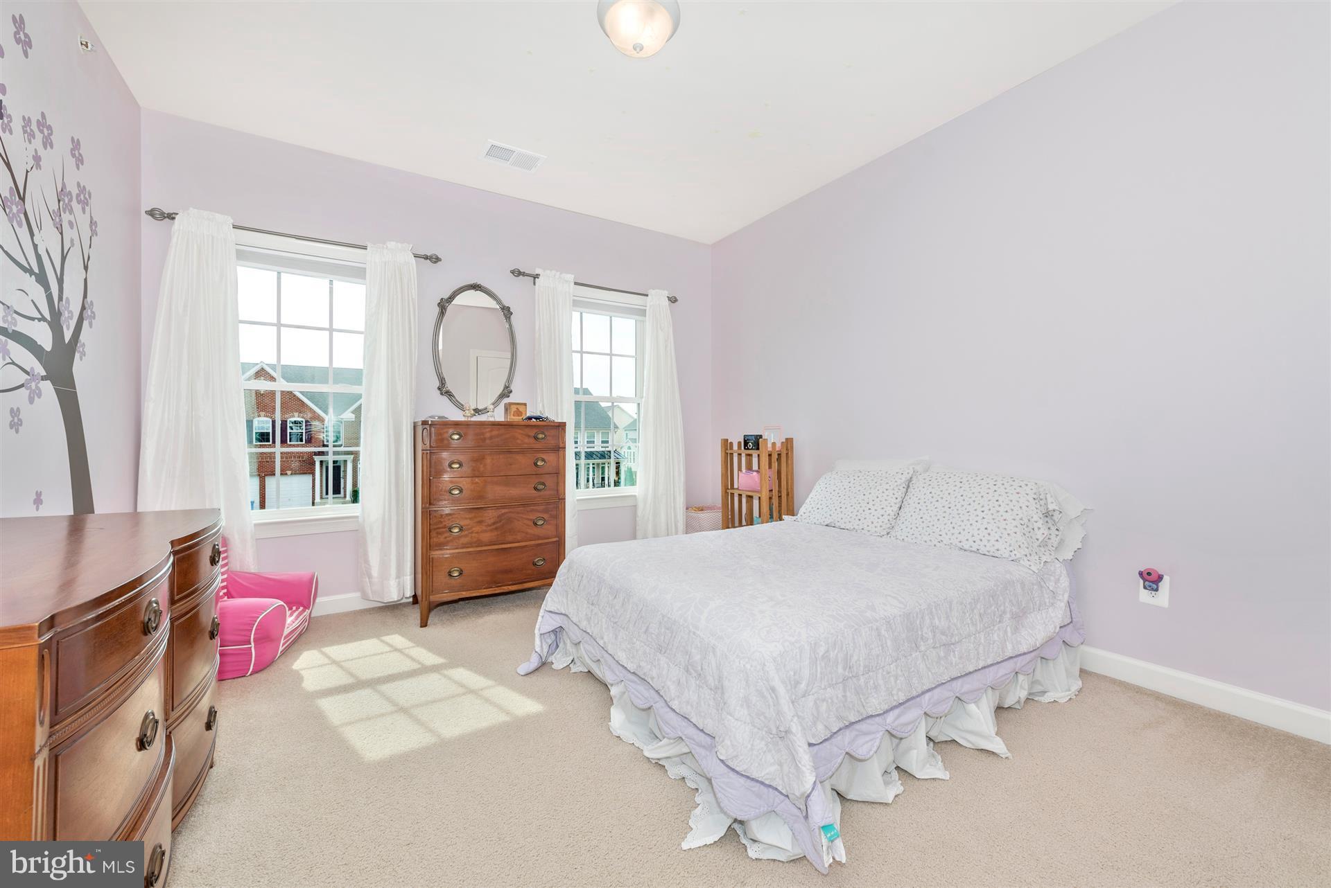 9158 Bealls Farm Road Frederick, MD 21704 - Photo 19 of 30 a bedroom with a bed dresser and a window
