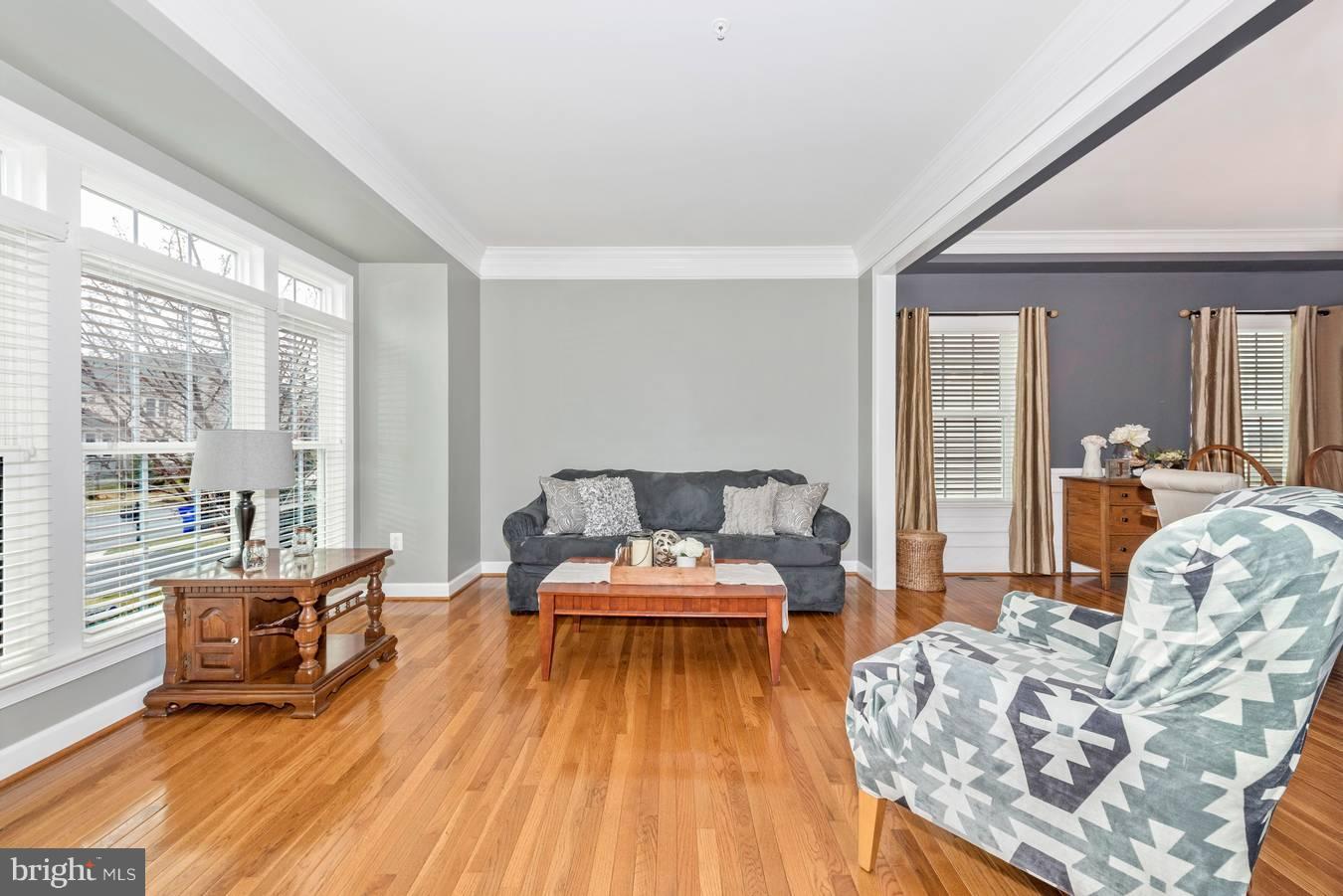 9158 Bealls Farm Road Frederick, MD 21704 - Photo 3 of 30 a living room with furniture and a wooden floor