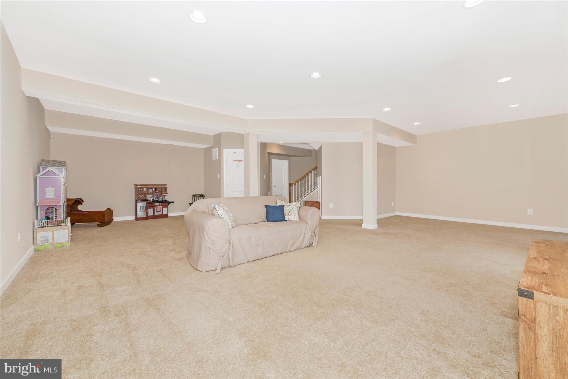 9158 Bealls Farm Road Frederick, MD 21704 - Photo 24 of 30 a living room with furniture and a couch
