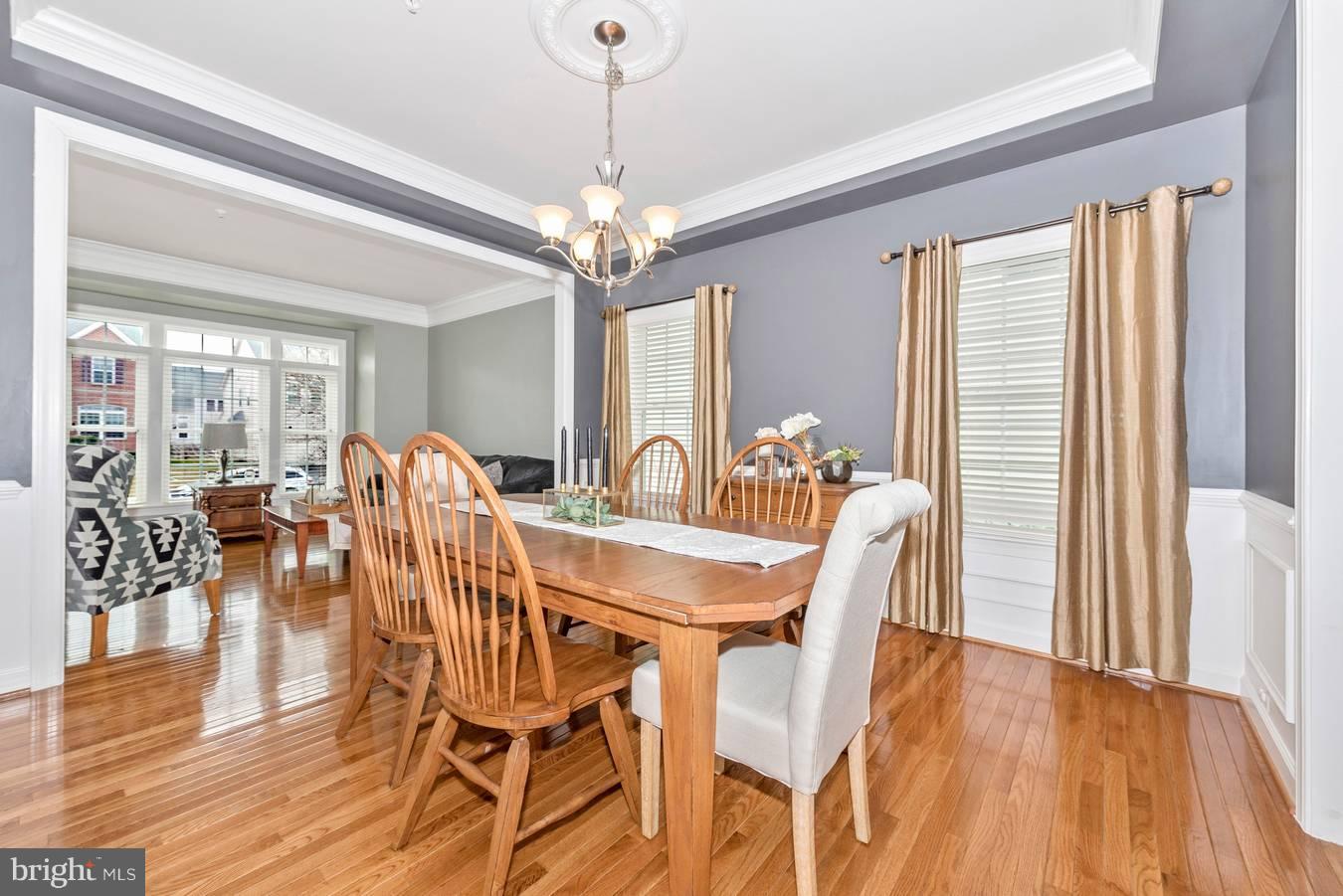 9158 Bealls Farm Road Frederick, MD 21704 - Photo 4 of 30 a view of a dining room with furniture window and wooden floor