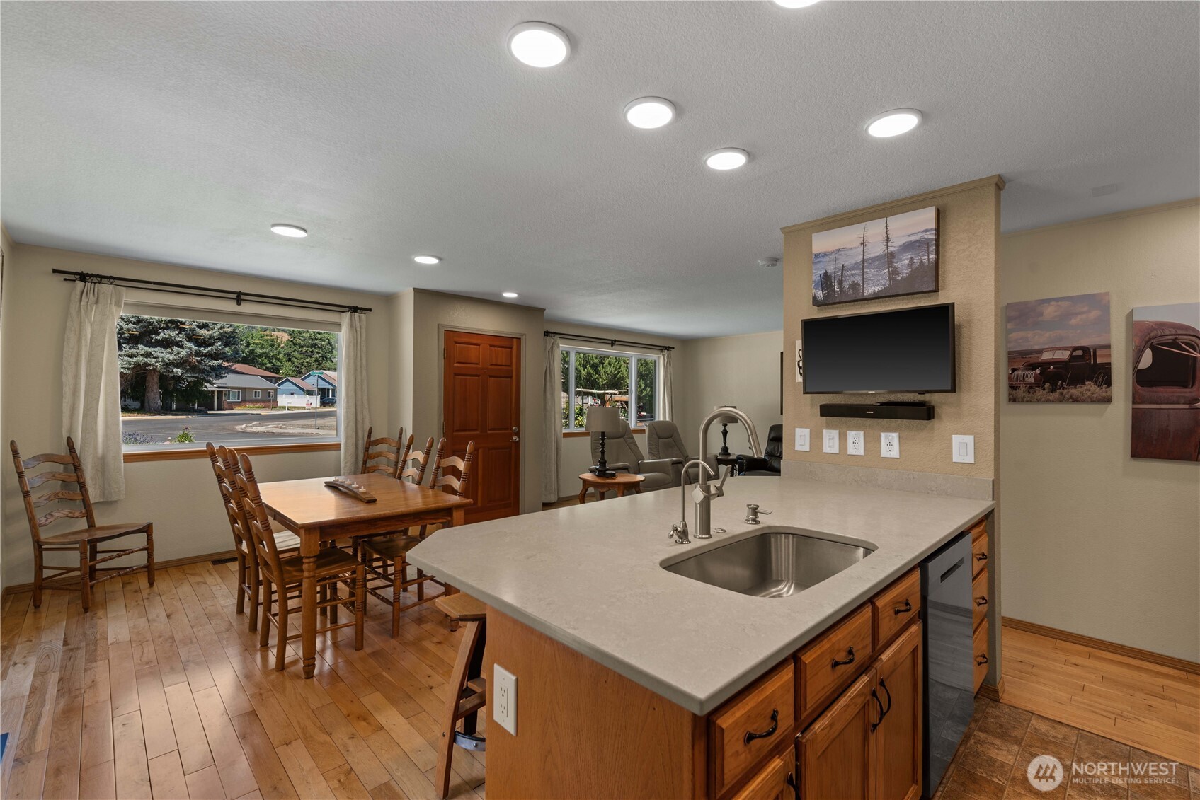 121 Benton Street Leavenworth, WA 98826 - Photo 11 of 37 a kitchen with stainless steel appliances granite countertop a sink a microwave counter and chairs