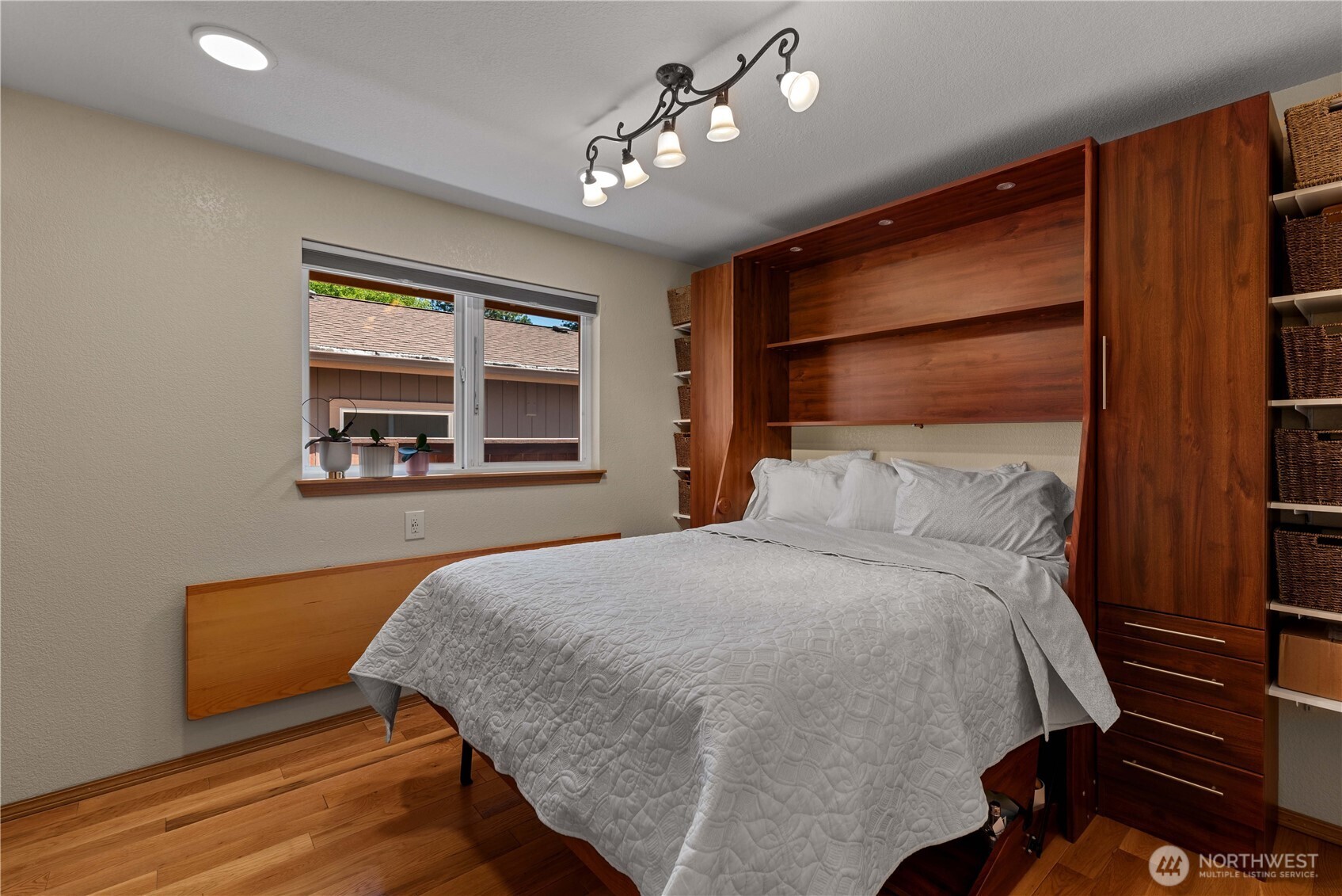 121 Benton Street Leavenworth, WA 98826 - Photo 19 of 37 a bedroom with a bed and wooden floor