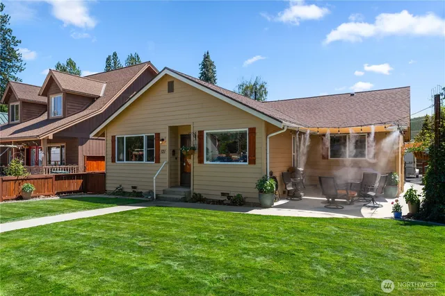 a front view of house with yard and green space