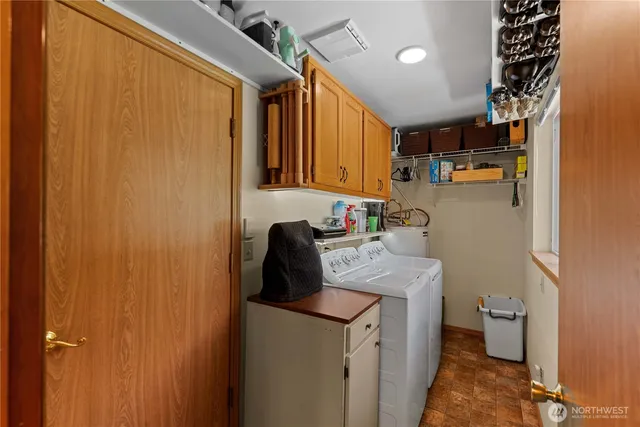 a kitchen with a sink and a refrigerator