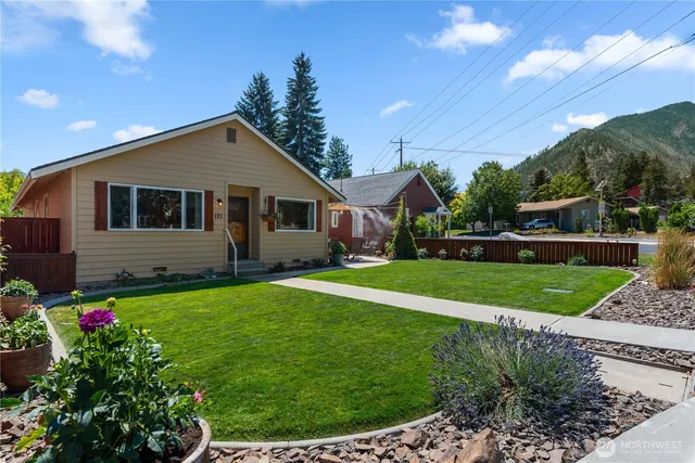 a front view of a house with a yard
