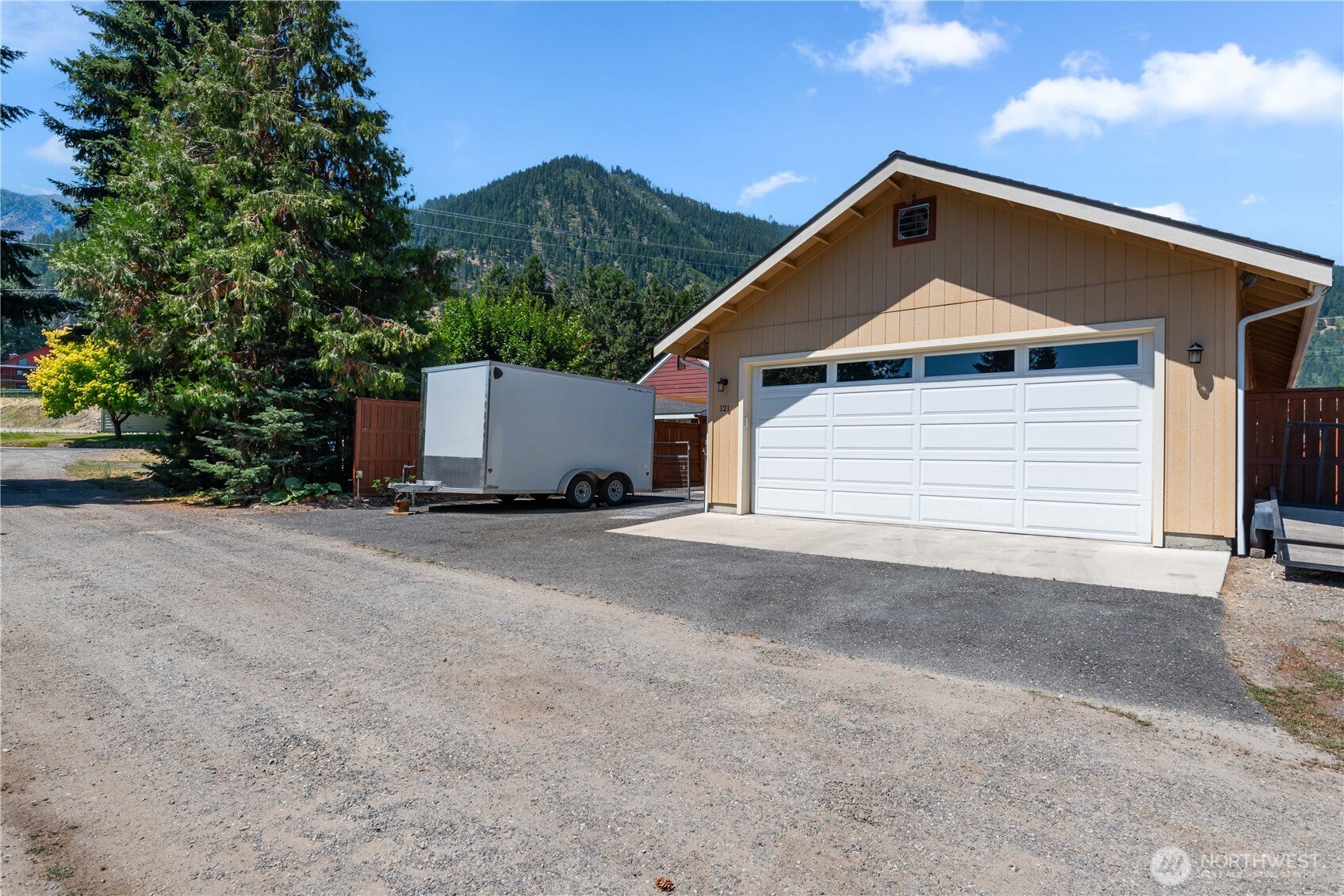 121 Benton Street Leavenworth, WA 98826 - Photo 31 of 37 a front view of a house with a yard and garage