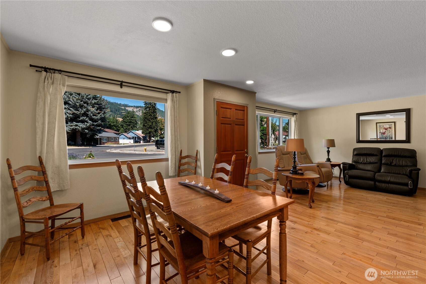 121 Benton Street Leavenworth, WA 98826 - Photo 4 of 37 a view of a dining room with furniture window and wooden floor
