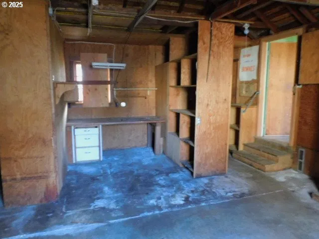 a view of an empty room with a fireplace