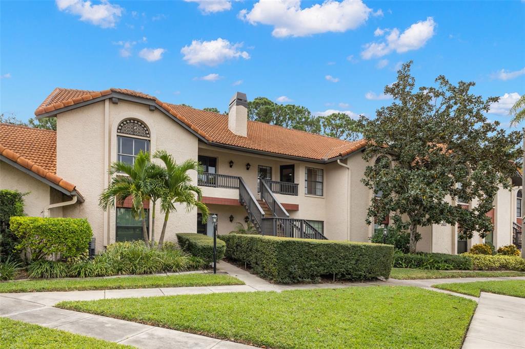 2632 Enterprise Road East, Unit A23 Clearwater, FL 33759 - Photo 1 of 1 a front view of a house with a yard