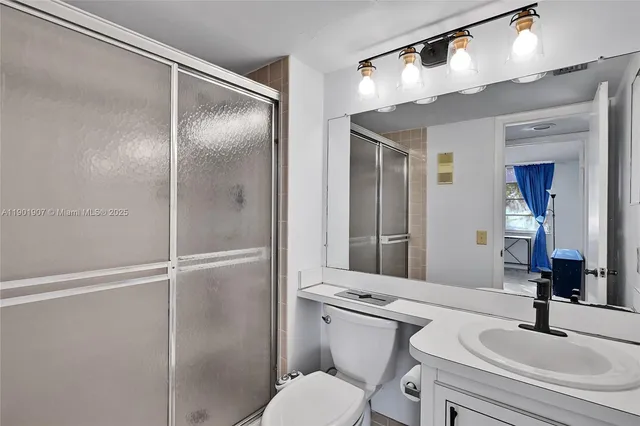 a kitchen with a refrigerator and sink