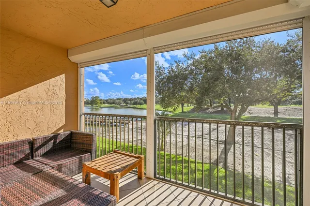 a view of balcony with wooden floor