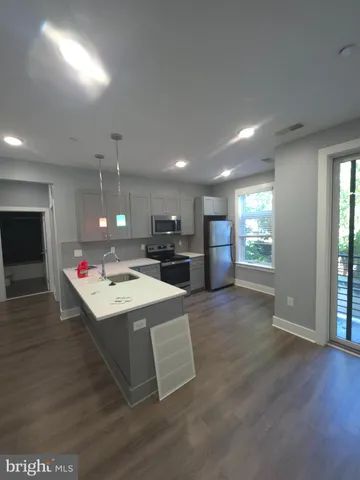 an open kitchen with a sink and an oven