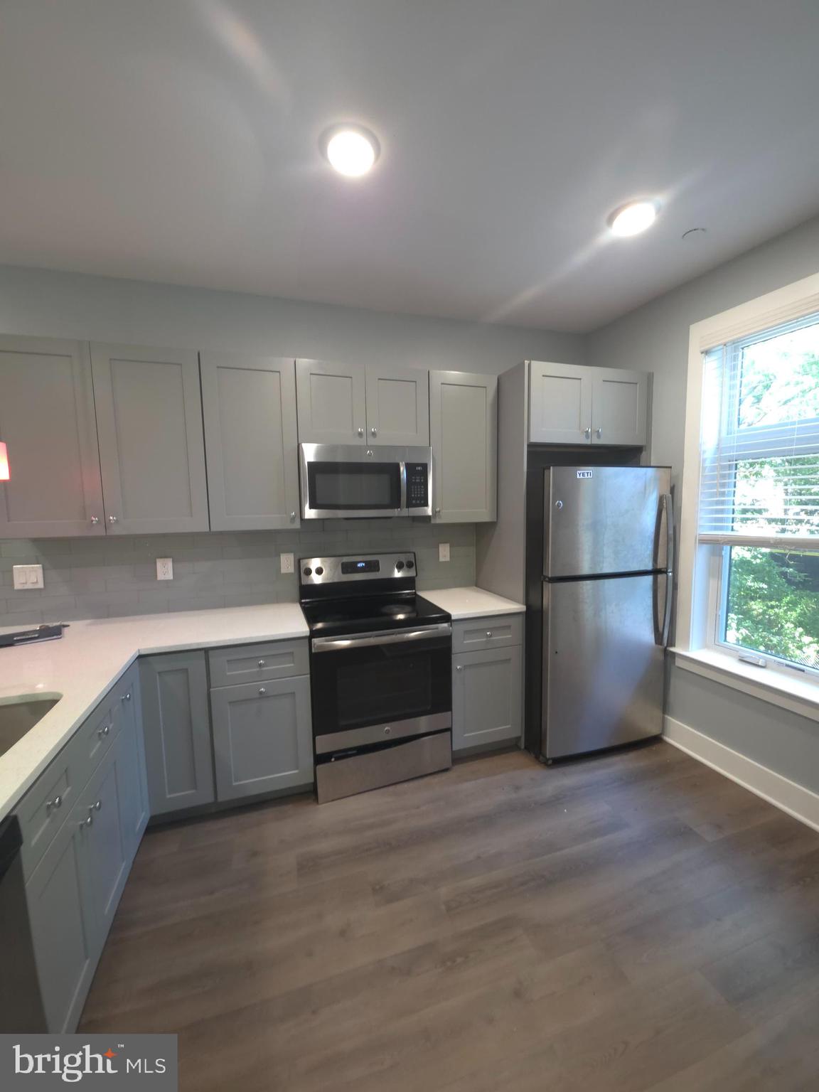 3925 Haverford Avenue, Unit 204 Philadelphia, PA 19104 - Photo 29 of 37 a kitchen with a refrigerator sink and microwave