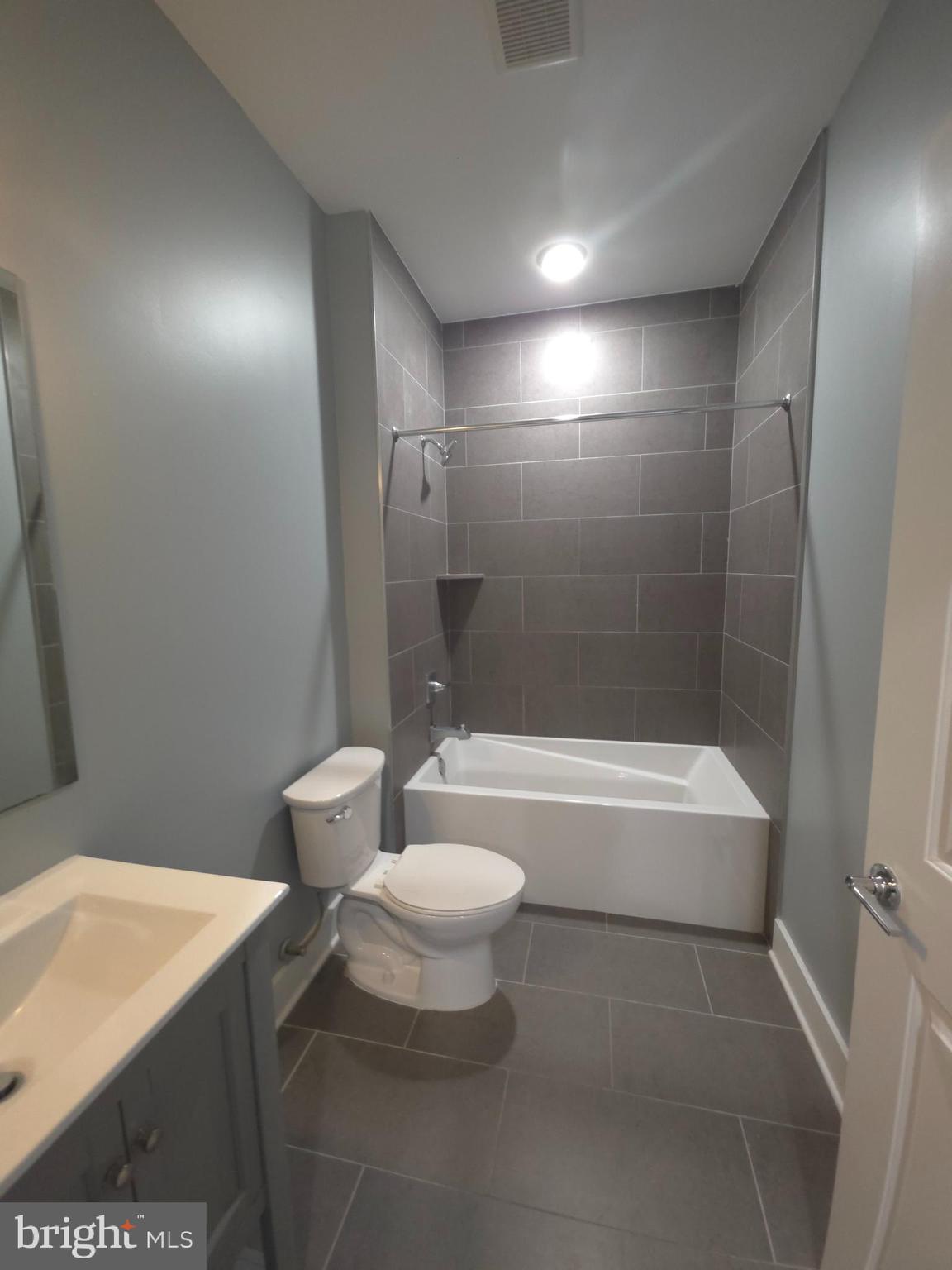 3925 Haverford Avenue, Unit 204 Philadelphia, PA 19104 - Photo 33 of 37 a bathroom with a sink a toilet and bathtub