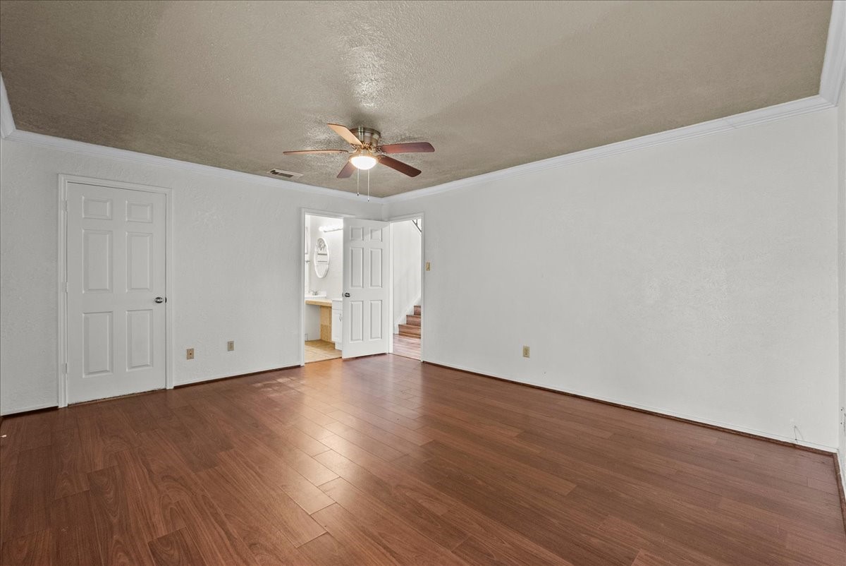 430 Redway Lane Houston, TX 77598 - Photo 13 of 43 a view of an empty room with wooden floor
