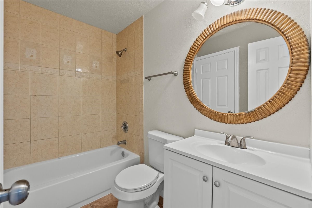 430 Redway Lane Houston, TX 77598 - Photo 14 of 43 a bathroom with a sink a toilet and a mirror
