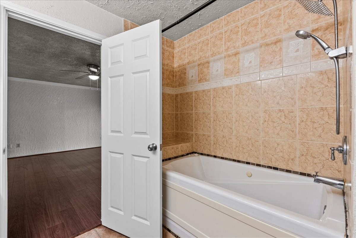 430 Redway Lane Houston, TX 77598 - Photo 15 of 43 a bathroom with a bathtub and a shower