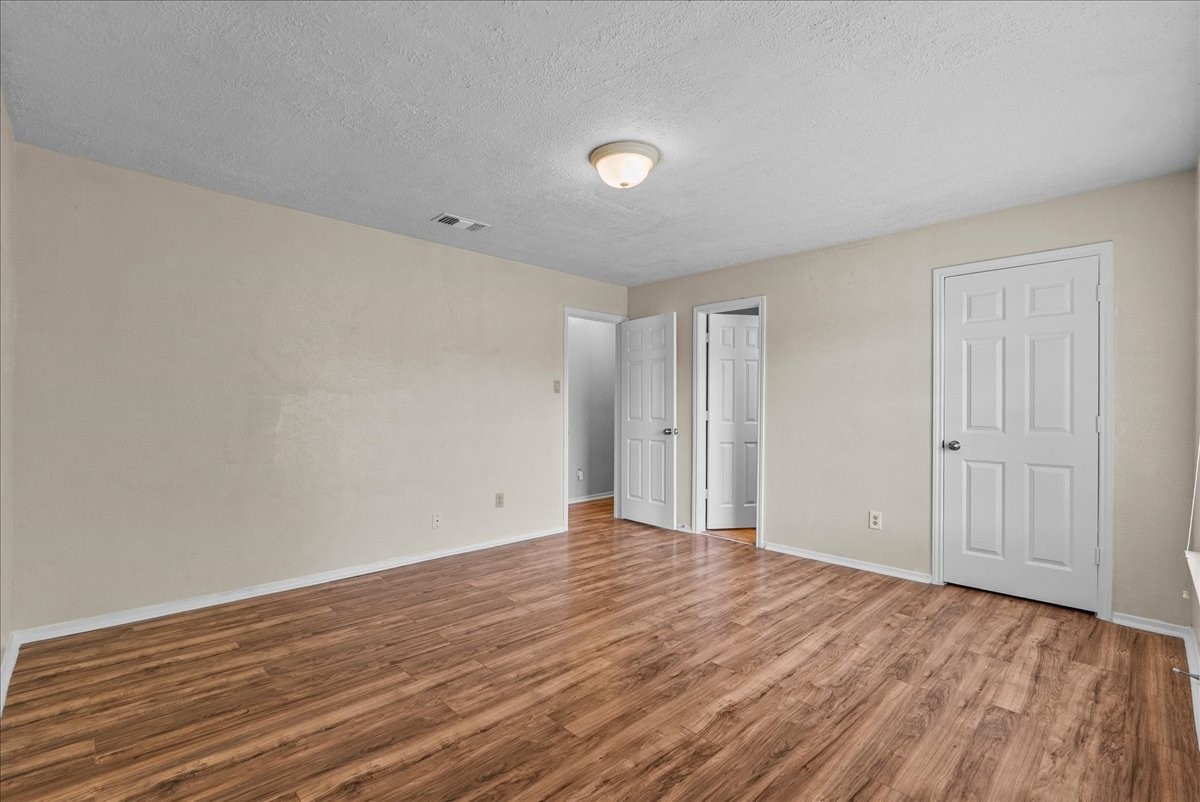 430 Redway Lane Houston, TX 77598 - Photo 29 of 43 a view of an empty room with wooden floor