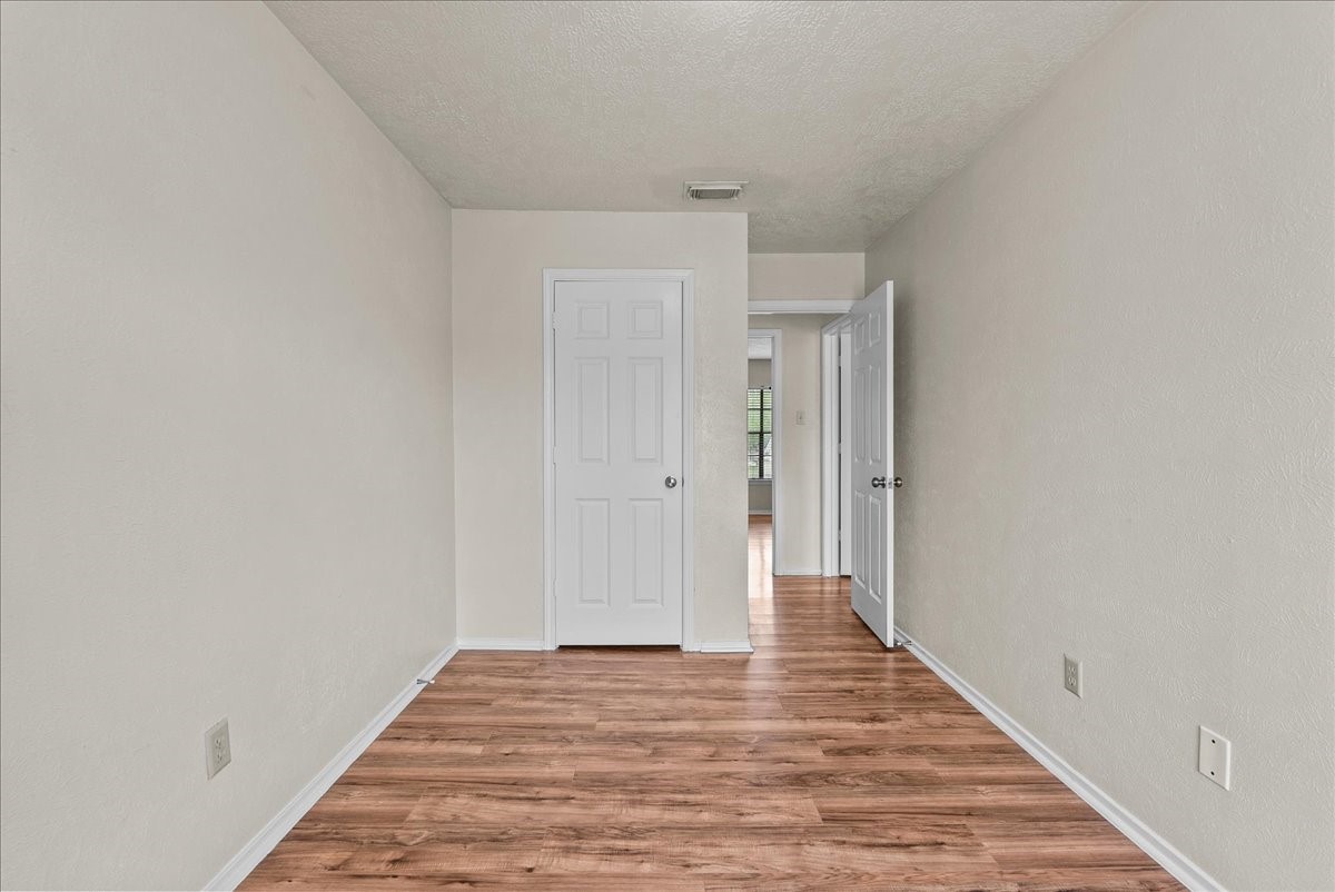 430 Redway Lane Houston, TX 77598 - Photo 36 of 43 a view of a hallway with wooden floor