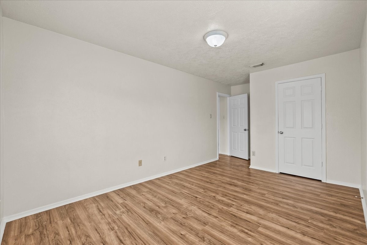 430 Redway Lane Houston, TX 77598 - Photo 38 of 43 a view of an empty room with wooden floor