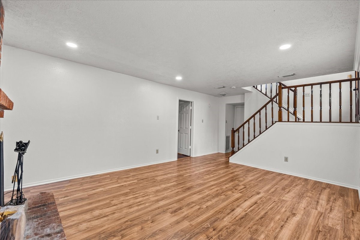 430 Redway Lane Houston, TX 77598 - Photo 10 of 43 a view of a hallway with wooden floor