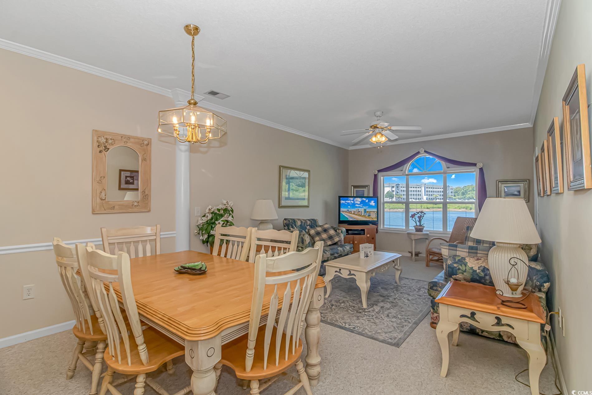 4501 West Harbour Court, Unit R6 Little River, SC 29566 - Photo 5 of 25 Dining room featuring carpet, ornamental molding,