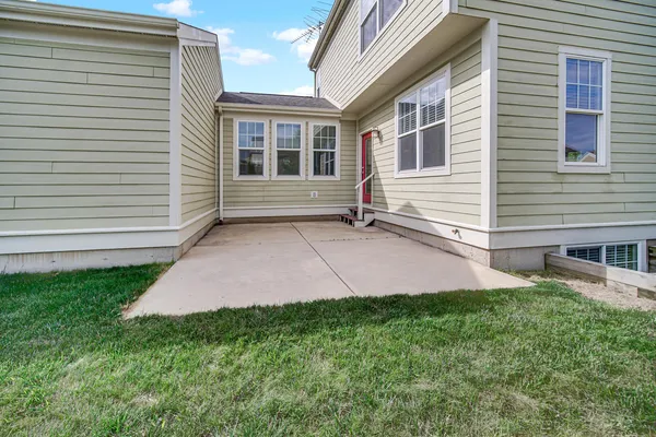 a view of a house with a backyard