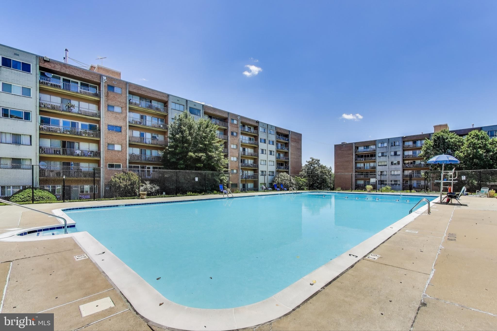 5851 Quantrell Avenue, Unit 407 Alexandria, VA 22312 - Photo 20 of 27 a view of swimming pool with outdoor seating