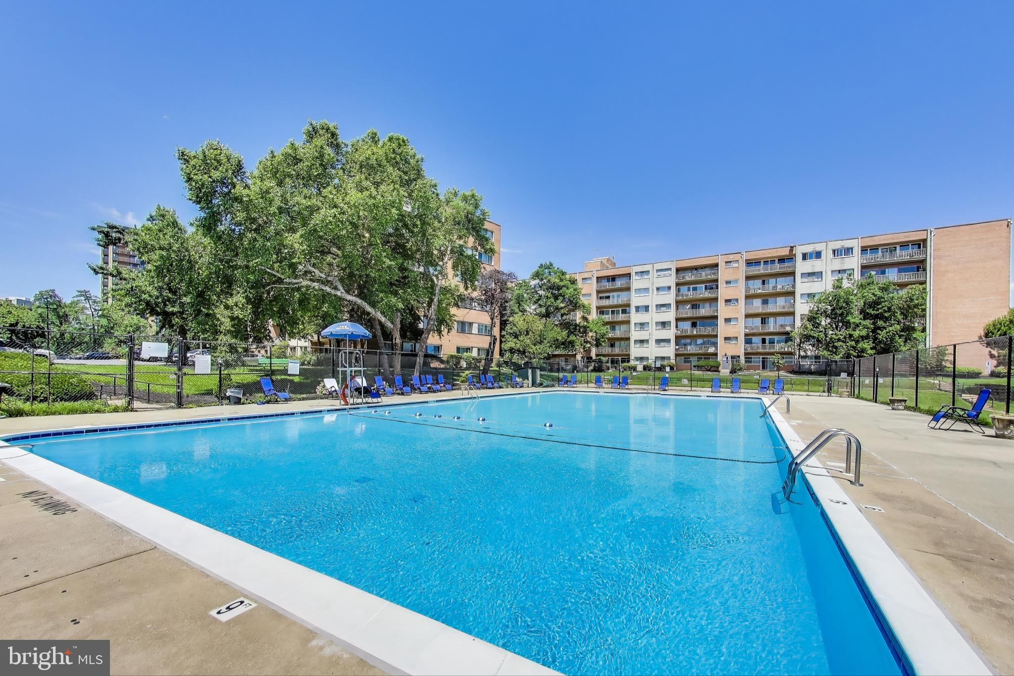 5851 Quantrell Avenue, Unit 407 Alexandria, VA 22312 - Photo 21 of 27 a view of swimming pool with a yard