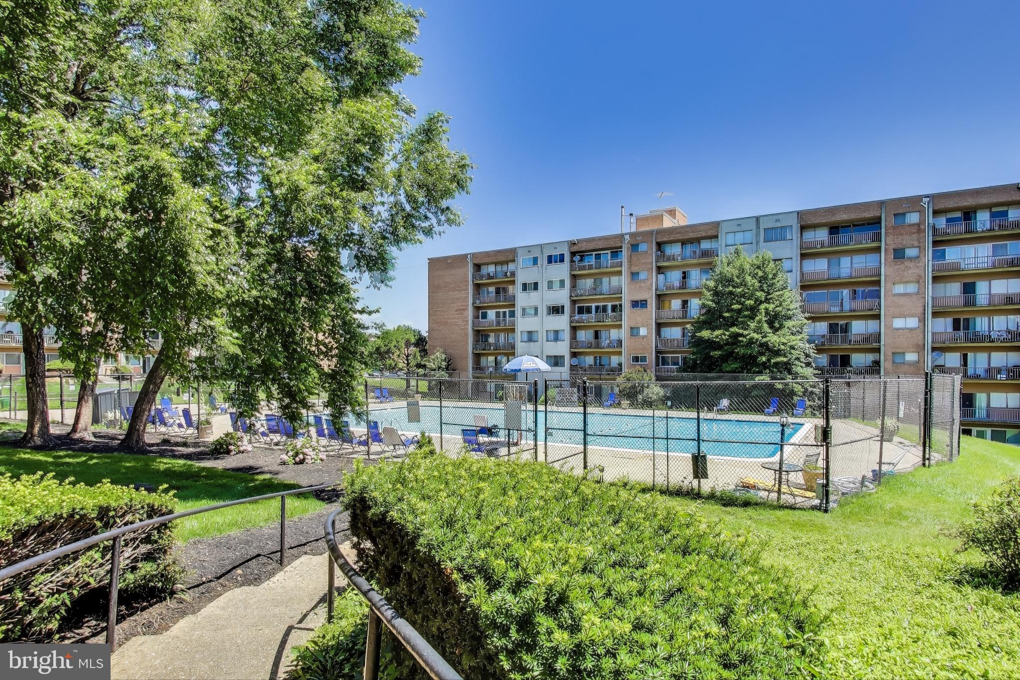 5851 Quantrell Avenue, Unit 407 Alexandria, VA 22312 - Photo 22 of 27 a view of a building with a yard