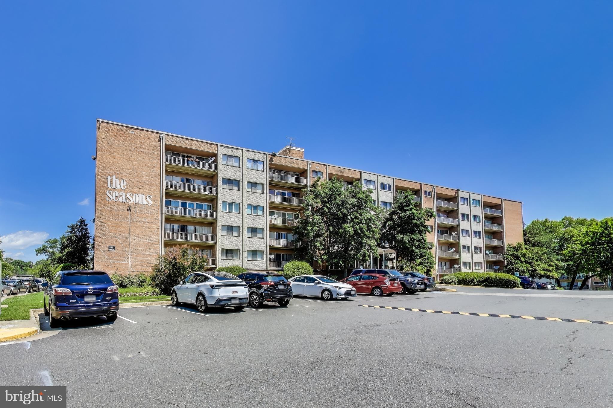5851 Quantrell Avenue, Unit 407 Alexandria, VA 22312 - Photo 24 of 27 a car parked in front of a building