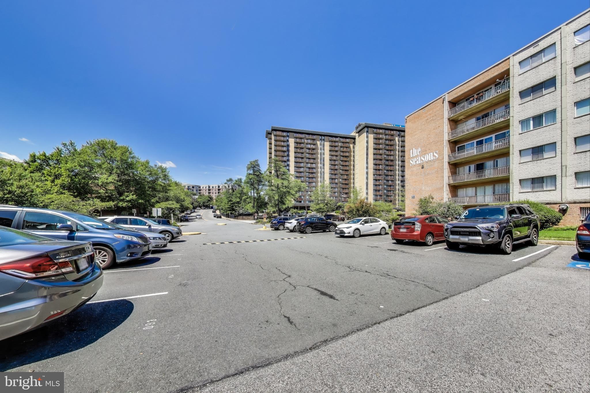 5851 Quantrell Avenue, Unit 407 Alexandria, VA 22312 - Photo 25 of 27 two cars parked in front of a building