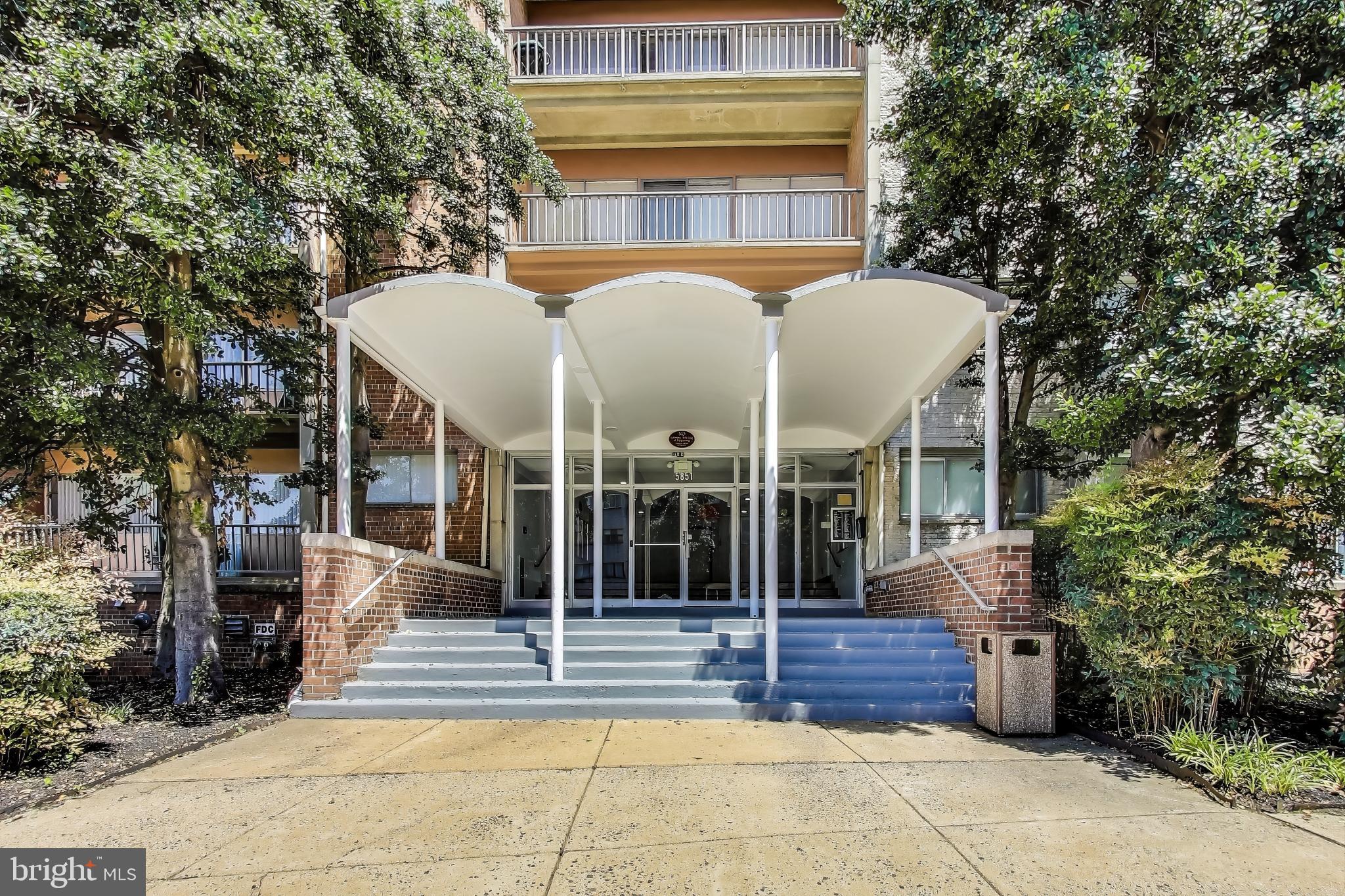 5851 Quantrell Avenue, Unit 407 Alexandria, VA 22312 - Photo 26 of 27 a view of a building with a porch