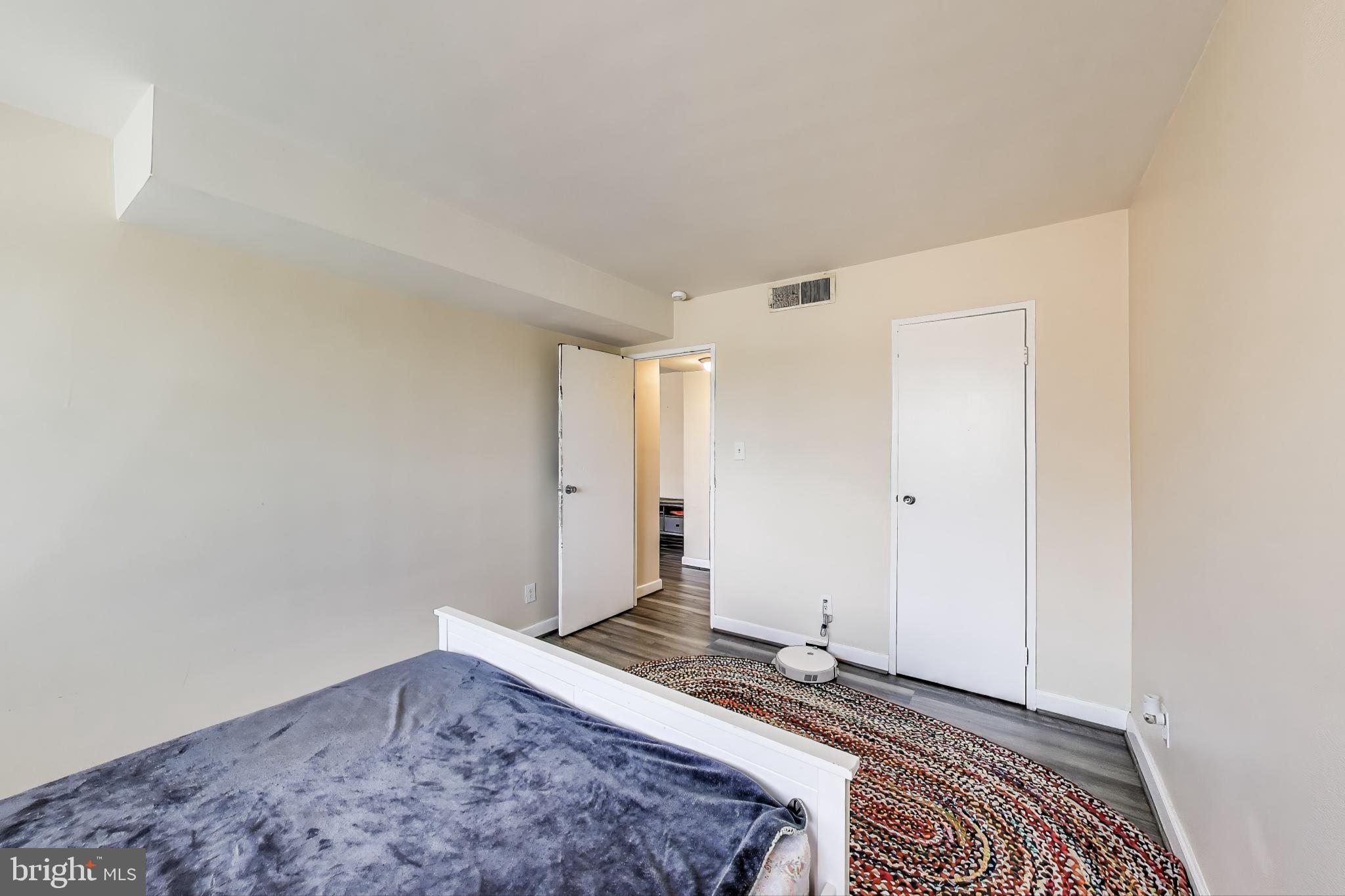 5851 Quantrell Avenue, Unit 407 Alexandria, VA 22312 - Photo 10 of 27 a view of a livingroom with wooden floor and a window