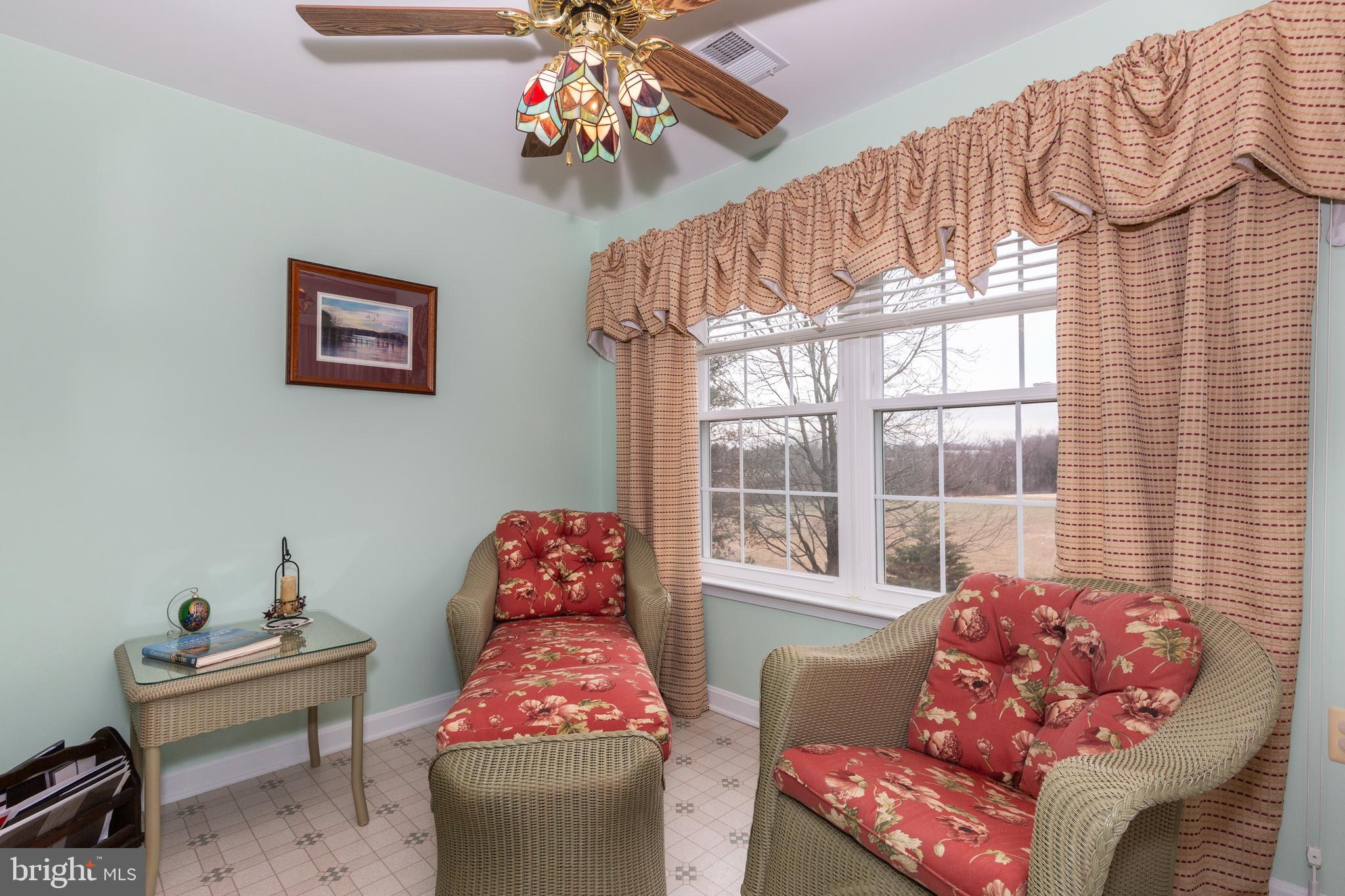 3850 Normandy Drive, Unit 2B Hampstead, MD 21074 - Photo 11 of 26 a living room with furniture and a large window
