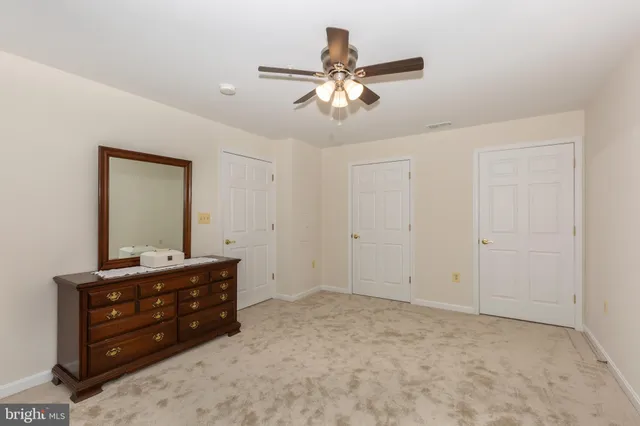 a room with a bed and a chandelier