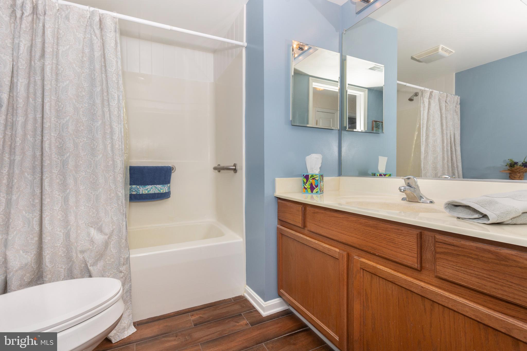 3850 Normandy Drive, Unit 2B Hampstead, MD 21074 - Photo 20 of 26 a bathroom with a sink a toilet and bathtub