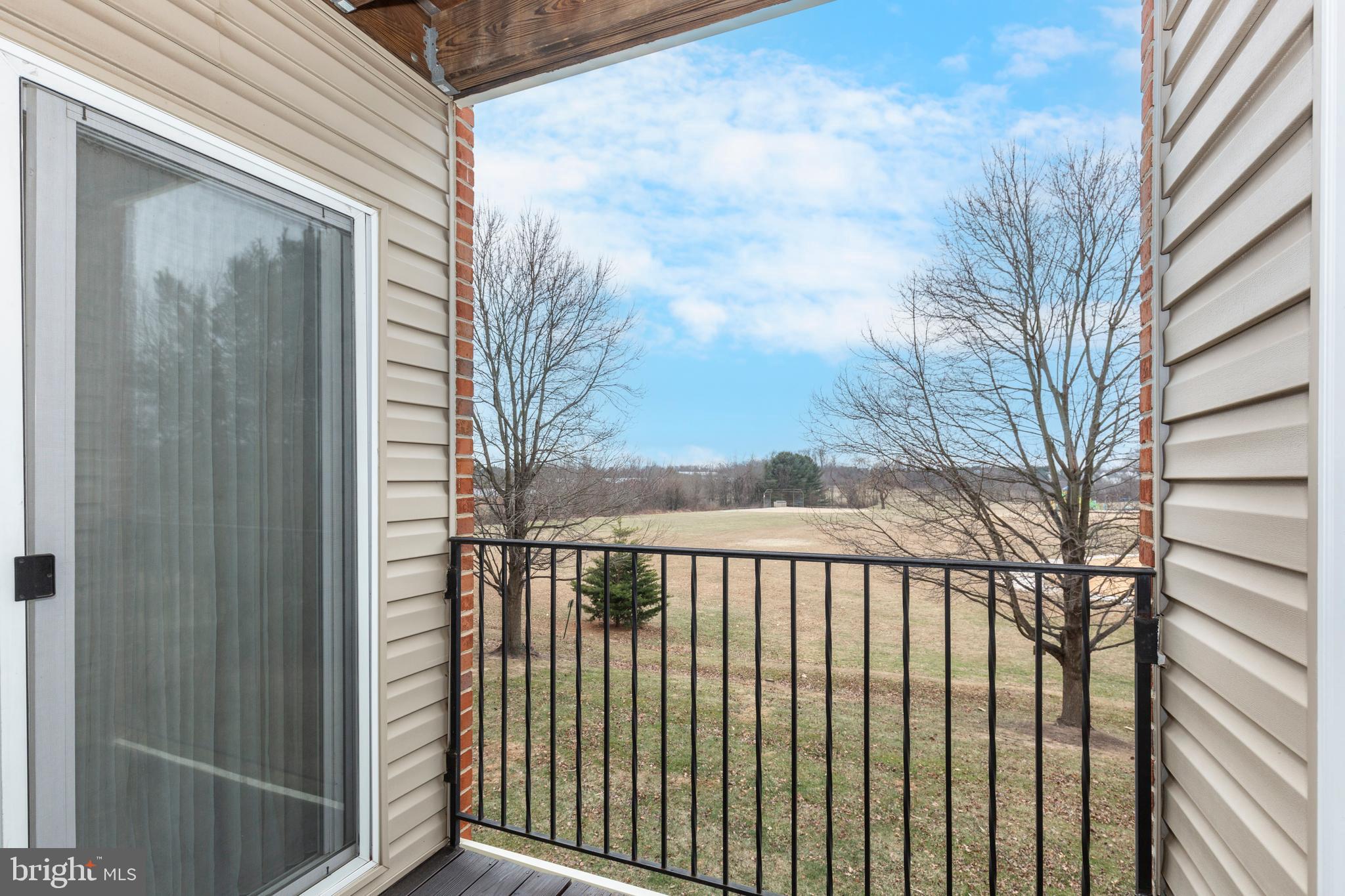3850 Normandy Drive, Unit 2B Hampstead, MD 21074 - Photo 22 of 26 a view of a balcony with a pot