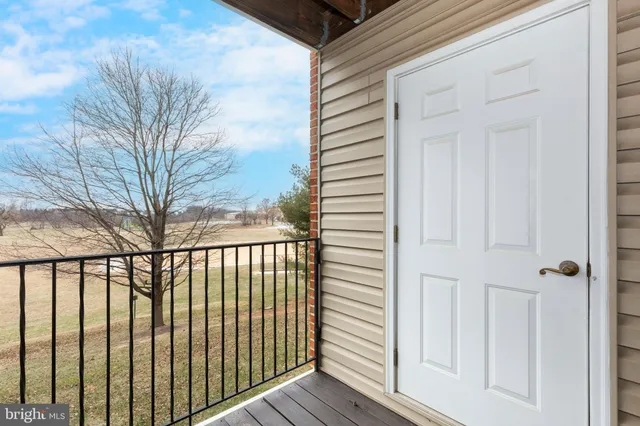 a view of a balcony with wooden floor